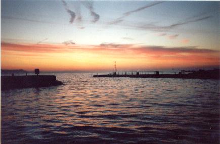 The Cobb harbour at sunrise  with views at Dorset, South West, UK